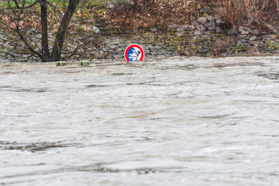 Flood sign in river during rainy season