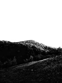 Low angle view of land against clear sky