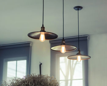 Illuminated pendants lights hanging at home