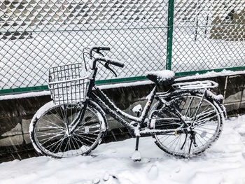 Bicycle parked on snow