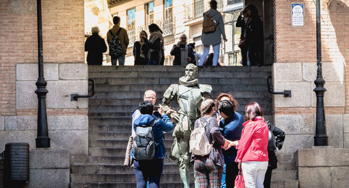 Group of people walking in front of building