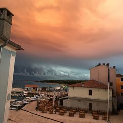 View of sea against cloudy sky during sunset