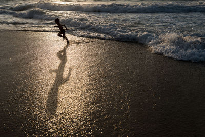 Shadow of man on beach