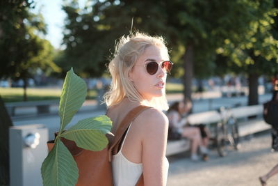 Portrait of young woman wearing sunglasses