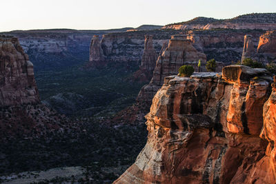 A young woman enjoys a view over colorado national monument in co.