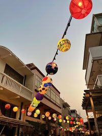 Celebrating mid autumn in hk, lanterns were hanged on the streets of tai o. low angle with bldg, sky