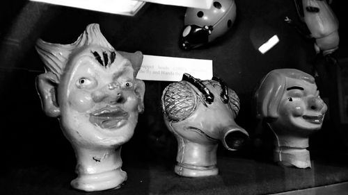 Close-up of mask against black background