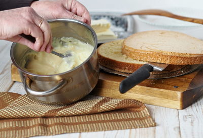 Midsection of man preparing food on cutting board