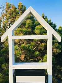 View of plants and trees on field against sky