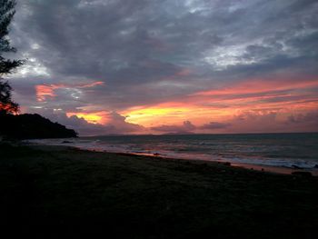 Scenic view of sea against dramatic sky