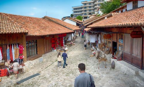 Rear view of people walking on roof