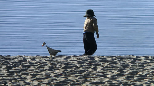 Rear view of woman on beach