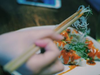 Close-up of hand holding food