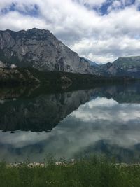 Scenic view of lake and mountains against sky