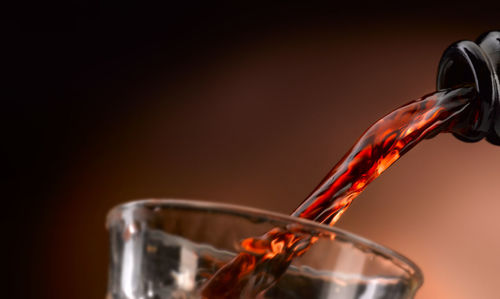 Close-up of drink pouring in glass