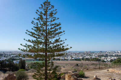 High angle view of townscape against clear blue sky