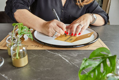 Midsection of woman having food