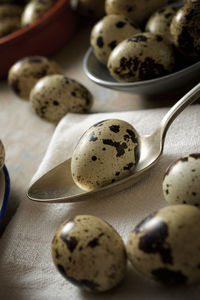 Quail eggs on a stone table.