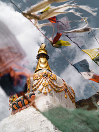 High angle view of person by temple against building