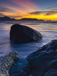 Scenic view of sea against sky during sunset