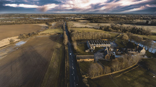 Aerial view of landscape against cloudy sky