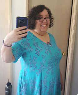 Portrait of smiling young woman using mobile phone