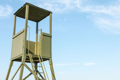 Low angle view of lifeguard hut against sky