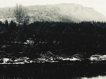 Scenic view of mountains against sky during winter