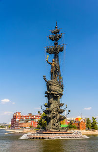 Sculpture of building against blue sky