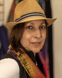 Portrait of smiling woman wearing hat