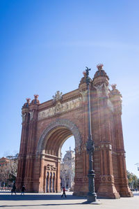 Low angle view of historical building against blue sky