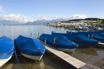 Sailing boats at the pier at the lake chiemsee in bavaria