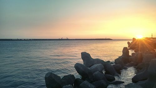 View of beach against sky during sunset