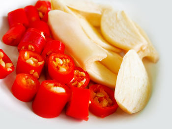 Close-up of chopped fruits and vegetables on plate