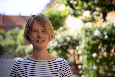 Portrait of smiling woman standing outdoors