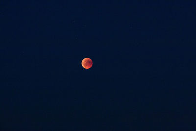 Low angle view of moon against sky at night