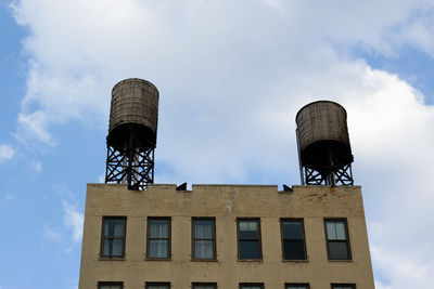 Low angle view of water tower against sky