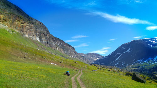 Man on mountain against sky