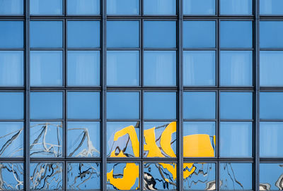 Full frame shot of yellow windows on building