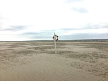 Man on beach against sky