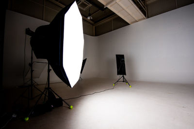 Low angle view of illuminated lighting equipment