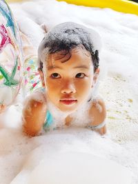 Portrait of cute boy in bathroom