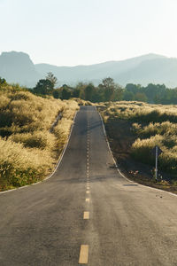 Empty road along landscape