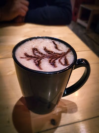 High angle view of coffee cup on table