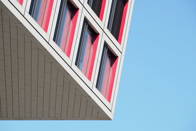 Low angle view of building against clear blue sky