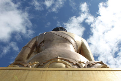 Low angle view of statue against sky