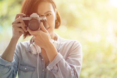 Portrait of woman photographing