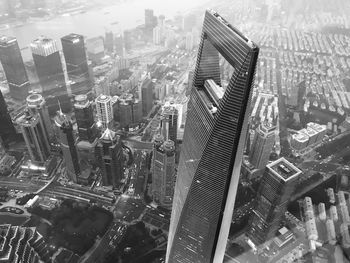 High angle view of modern buildings in city against sky