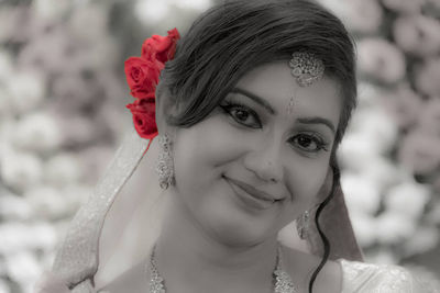 Close-up portrait of a smiling young woman