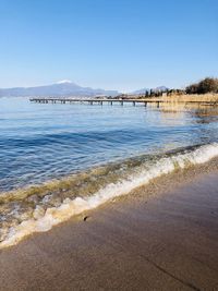 Scenic view of beach against clear sky